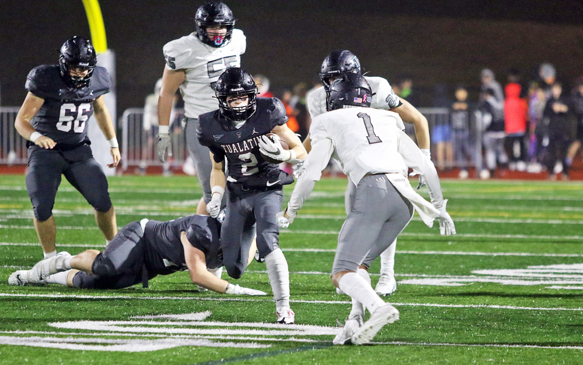 The Tualatin Tigers pulled off a 31-21 rain-soaked win over Tigard in the Three Rivers League finale on October 28, 2022 at Tualatin High School in Oregon.